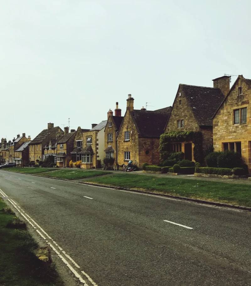 130518852empty road by houses against clear sky1048944 2